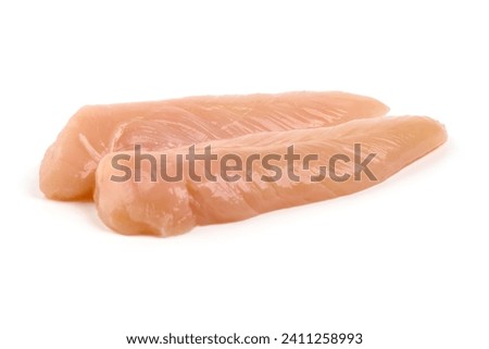Chicken Breast Mini Fillets, isolated on white background. High resolution image Royalty-Free Stock Photo #2411258993
