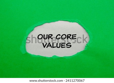 Our core values lettering on ripped green paper with gray background. Business concept photo. Top view, copy space.