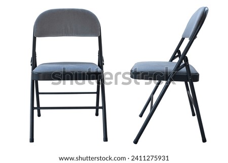 Metal folding chair, A classic black metal folding chair, Folding chairs are used for all types of events and gatherings, they fold closed for easy storage and transportation, Isolated on white. Royalty-Free Stock Photo #2411275931
