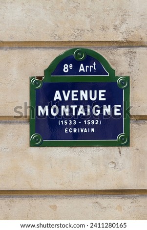 Parisian street sign: Avenue Montaigne - Paris 8th arrondissement Royalty-Free Stock Photo #2411280165