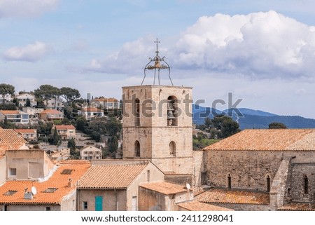 Scenic view of old church bell tower in Hyeres south of France against dramatic sky Royalty-Free Stock Photo #2411298041