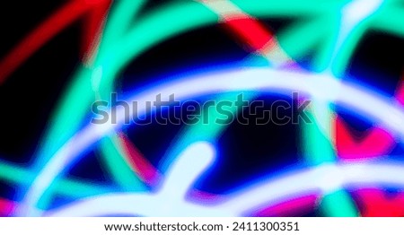 Abstract electric line neon colorful gradient black background. Concept three color red green blue light trail slow shutter speed.