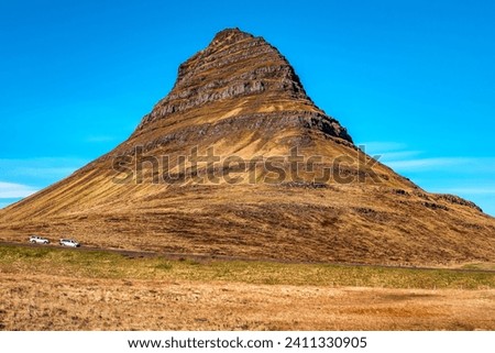 Close up of Moody Kirkjufell mountain peak in sunny day in Iceland. Travel theme
