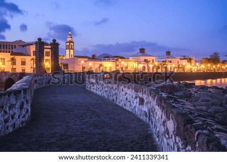 Blue hour image of the town of Arrecife on the island of Lanzarote, Canary islands, Spain, Europe.  Royalty-Free Stock Photo #2411339341