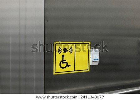 Accessible Elevator with sign. Disabled persons lift near modern apartment facility. The special elevator for the disabled at the entrance to the living house. Equipment with the wheelchair.