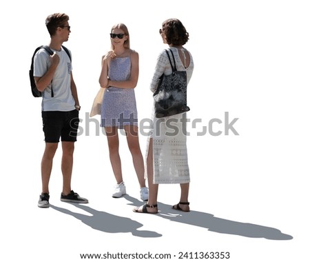 Backlit group of three friends standing outside in summer and talking isolated on white background Royalty-Free Stock Photo #2411363353