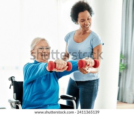 Doctor or nurse or physiotherapist caregiver exercise with senior woman at clinic or nursing home, woman with chronic health condition, disabled person, people with paraplegia Royalty-Free Stock Photo #2411365139