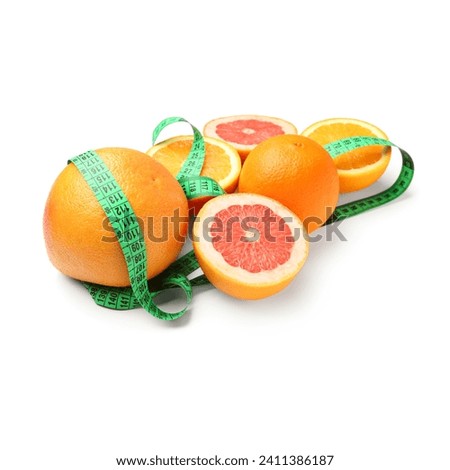 Cut oranges and green measuring tape on white background. Diet concept