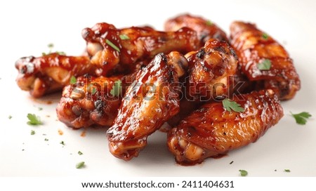 Chicken wings in BBQ sauce on a white background. Stock photo for grills, restaurant menus, and recipes