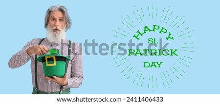 Greeting banner for St. Patrick's Day with surprised senior man drinking green beer on light blue background 