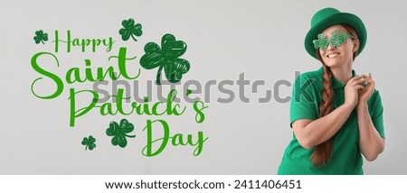 Greeting banner for St. Patrick's Day with beautiful woman on light background 