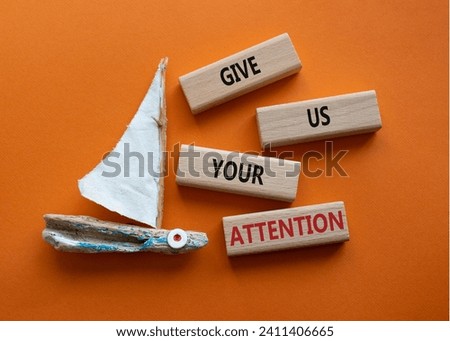 Attention symbol. Concept word Give us your attention on wooden blocks. Beautiful orange background with boat. Business and Give us your attention concept. Copy space