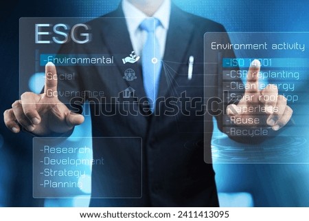 ESG environmental social governance concept with businessman touch on virtual screen to research the environment activity for co2 emission reduction in leading company take care the environment