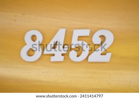 The golden yellow painted wood panel for the background, number 8452, is made from white painted wood.