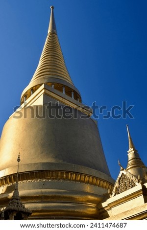 Thailand Bangkok Wat Phra Kaew Phra Si Rattana Golden Chedi Againbst Blue sky