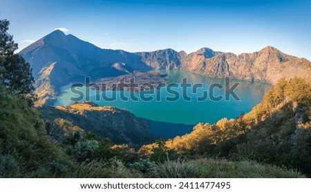 Senaru viewpoint from Rijani Mount 3726m in blue sky. Mount Rinjani (Gunung Rinjani) is an active volcano in Indonesia on the island of Lombok.