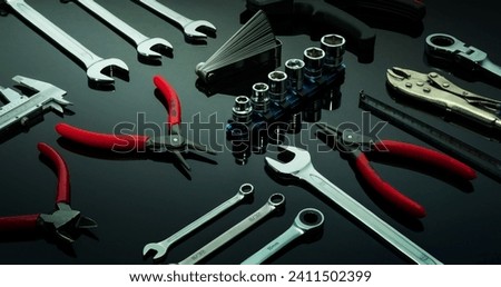 Set of mechanic tools. Chrome wrenches or spanners, hexagon socket, end cutter pliers, locking pliers, vernier caliper, pincers, feeler gauge, and tape measure. Chrome vanadium spanner wrench. Royalty-Free Stock Photo #2411502399