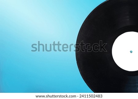 single circular vinyl record blue background