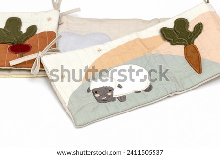 Toys for babies. Soft book with two rabbits. Baby background. High quality photo