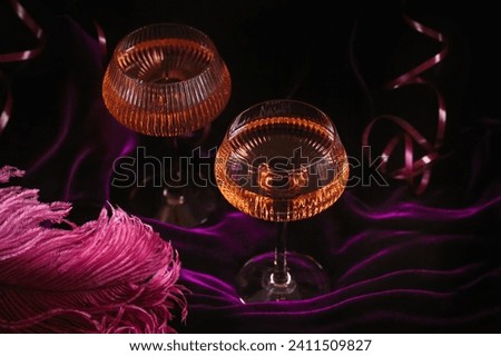 Extravagant glamour background with glass of sparkling wine for love party at muffled light. Beautiful romantic burlesque place for valentines holiday