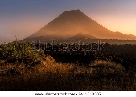 The Pico do Fogo volcano and the lava field at the foggy beautiful sunset at Fogo island, Cape Verde.