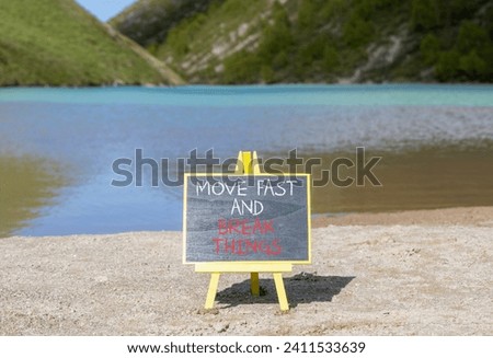 Move fast and break things symbol. Concept words Move fast and break things on beautiful blackboard. Beautiful mountain lake background. Business, move fast and break things concept. Copy space.