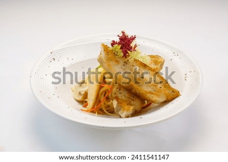 Pan fried halibut with creamy pasta and mushroom served in plate isolated on wooden table side view of hong kong fast food