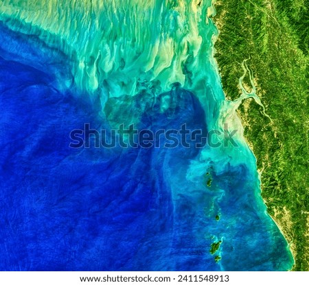 Making Waves in the Andaman Sea. When tides, currents, and gravity move water masses over seafloor features, they can create wave actions. Elements of this image furnished by NASA. Royalty-Free Stock Photo #2411548913