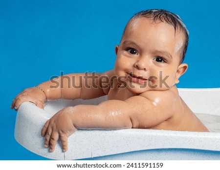 a baby bathes in a bathtub