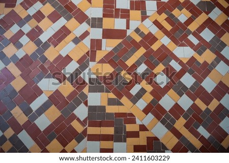 Colorful mosaic tiles floor. Interesting shapes triangles mosaics. Background texture mosaic. High quality photo