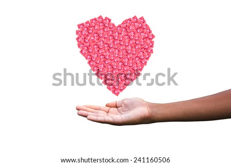 Human hands holding a heart made of roses