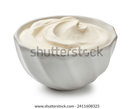 sour cream yogurt in bowl isolated on white background Royalty-Free Stock Photo #2411608325