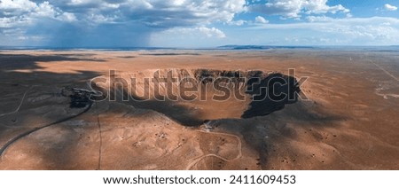 Aerial view of the Meteor Crater Natural Landmark at Arizona. Crater from a meteorite, from space. Elements of this image furnished by NASA. High quality photo Royalty-Free Stock Photo #2411609453