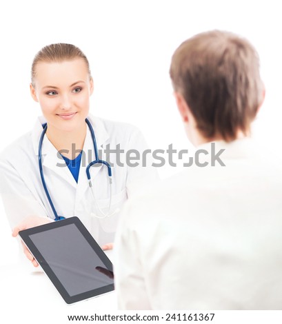 A young and attractive female doctor with a tablet computer showing information to a patient. Image isolated on a white background.