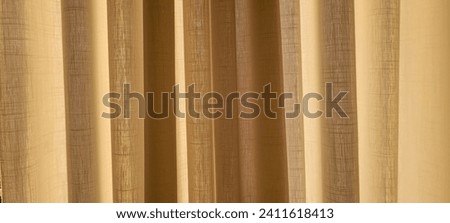 "Radiant and welcoming, this sunlit house curtain creates a warm and inviting atmosphere. Purchase this image and illuminate your projects with luminosity and comfort!" Royalty-Free Stock Photo #2411618413
