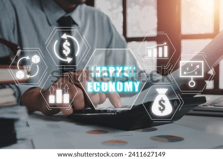 Market economy concept, Businessman using calculator and document paper on desk with market economy icon on virtual screen.