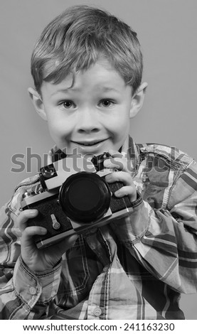 Boy Playing with Vintage Camera