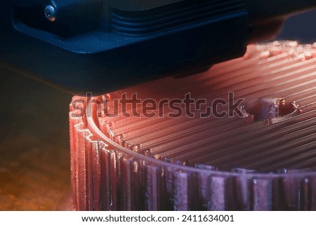 Close up scene the additive manufacturing by 3D printer machine. The high technology manufacturing process by rapid prototype method.  Royalty-Free Stock Photo #2411634001