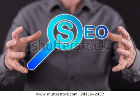 Seo concept between hands of a man in background