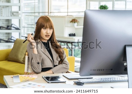 Young asian woman graphic designer working in office. Artist Creative Designer Illustrator Graphic Skill Concept, corporate women in creative marketing team working on project management, thinking