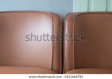 Close up detail brown leather sofa. Furniture design.