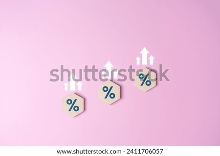 Hexagonal wood blocks with percentage symbols and white arrow up icons. Interest rate financial rise and mortgage rates hike concept. Loan mortgage, VAT, inflation, tax, sale price. Stock investment.