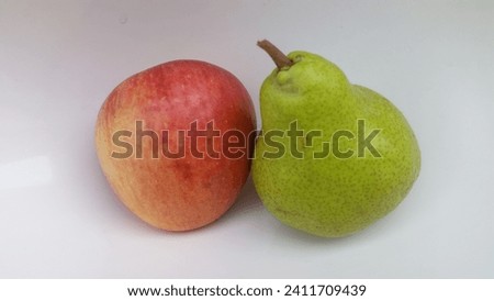 this is a picture of a green pear and apple