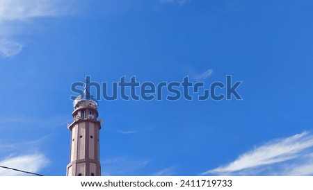 Minaret of Almuttaqin Mosque on the sky. Islamic background mosque. Mosque design in Islamic religious architectural traditions. Creative abstract photography. Ramadhan vibes