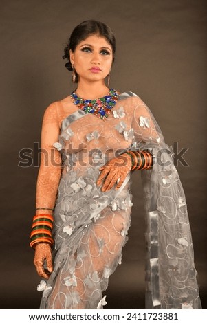 Beautiful portrait of young bride wearing grey saree 