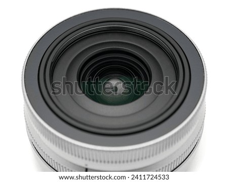 Digital camera lens close-up over white background    