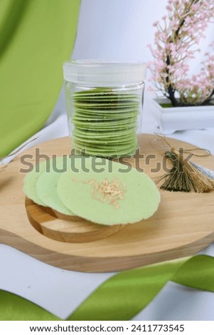 Homemade almond crispy green tea, with a crispy texture and sweet taste. Almond crispy is one of the semi-modern traditional snacks typical of Surabaya, Java, Indonesia. Top view.