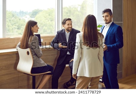 Business people in formal chat, speaking, presentation, critical thinking and teamwork skills. Happy office friends, students in strategic managerial communication, creating effective team Royalty-Free Stock Photo #2411778729
