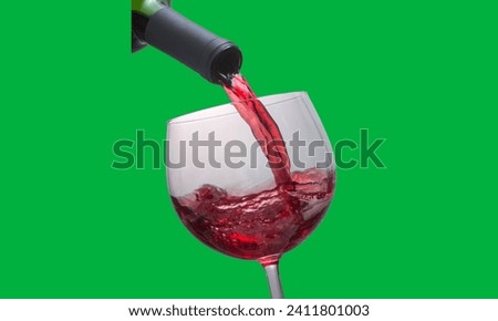 A green screen shows wine pouring from a wine bottle into a glass