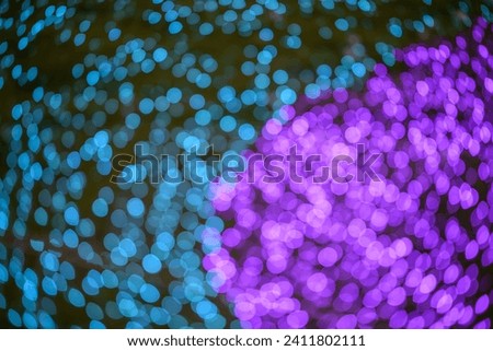 Colored decorative festive bokeh lights sparkle brightly. Abstract bokeh background. 
